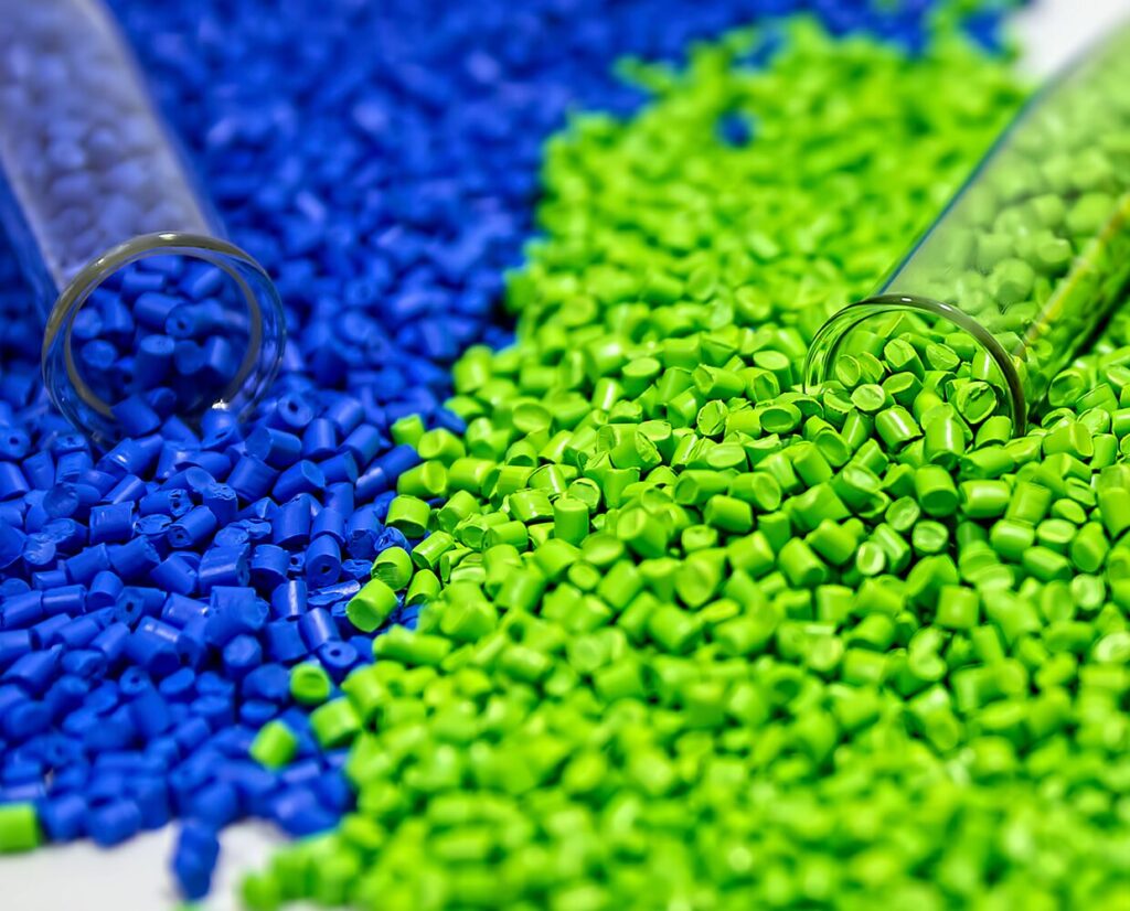 blue and green pellets spilling out of two clear vials