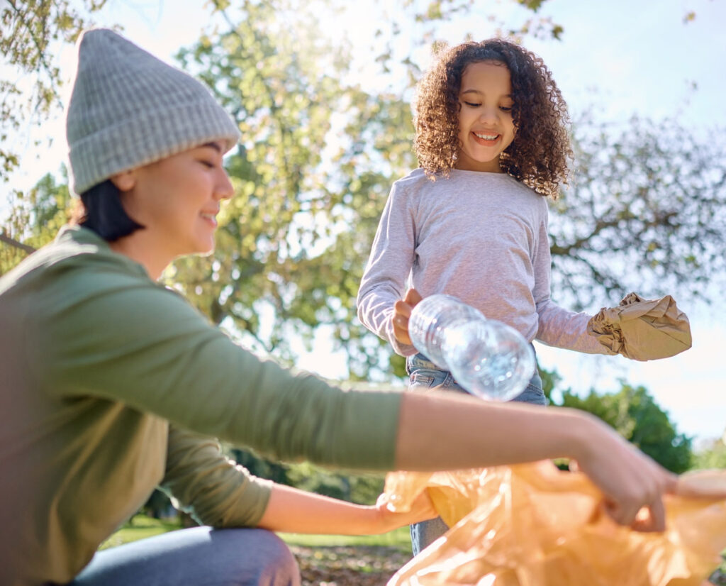 women and young girl recycling