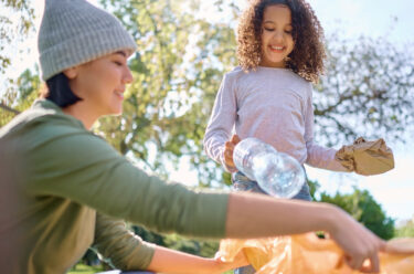 women and young girl recycling