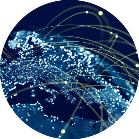 A blue globe with many bright yellow lines connecting cities.