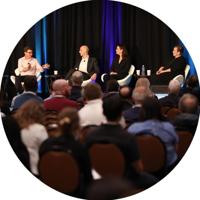 group of people speaking on a stage