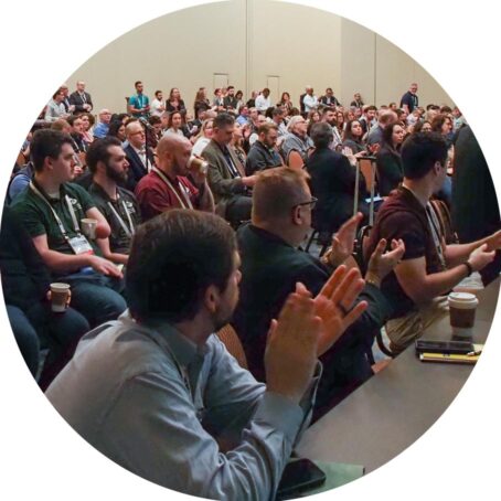 large room of people clapping