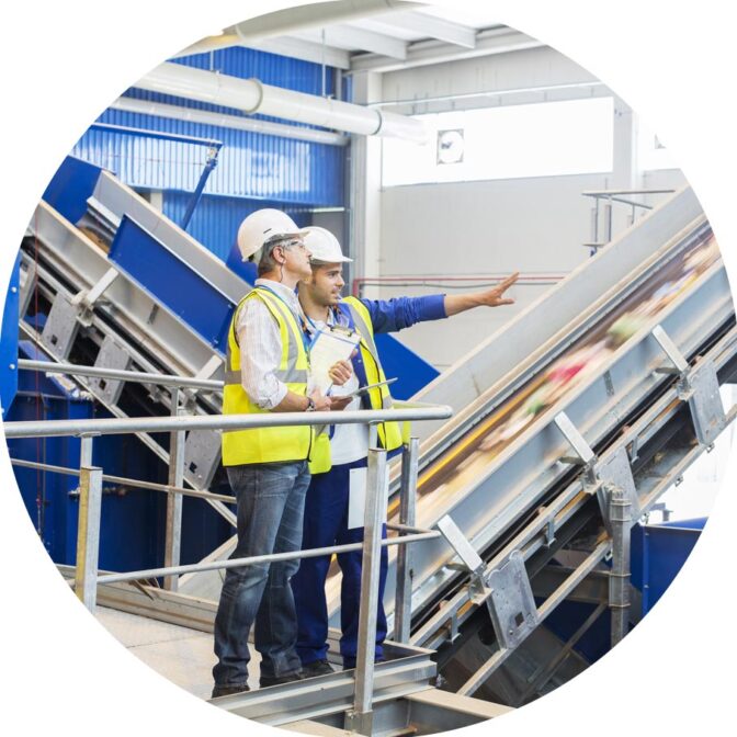 two people working in MRF or testing facility