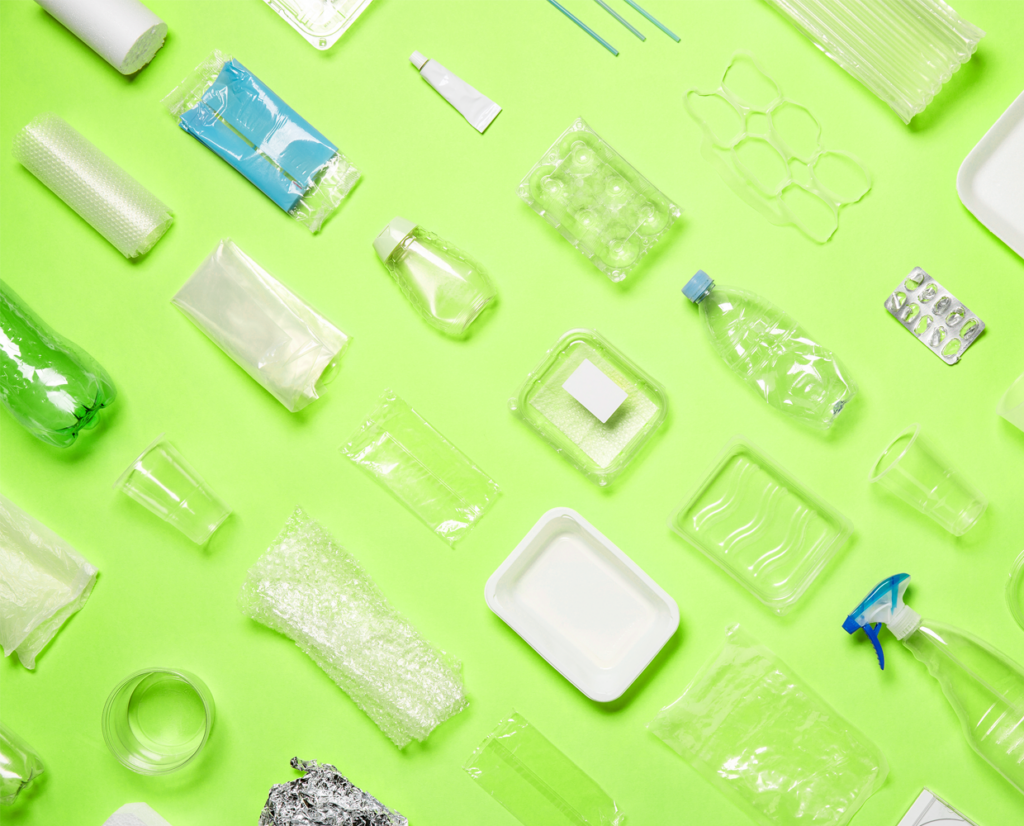 various types of plastic packaging on a green background